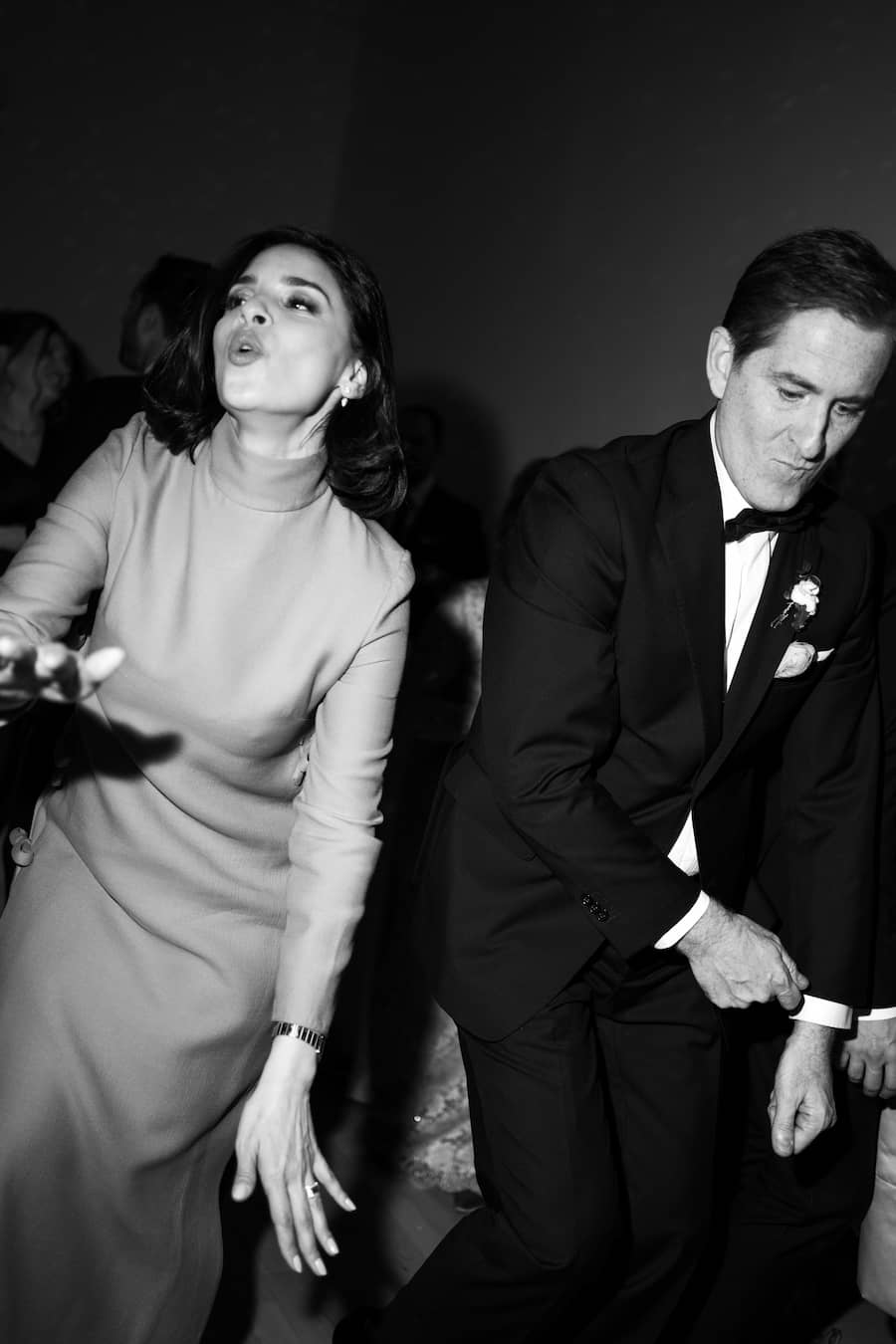 Black and white photo of a couple dancing on a dance floor.