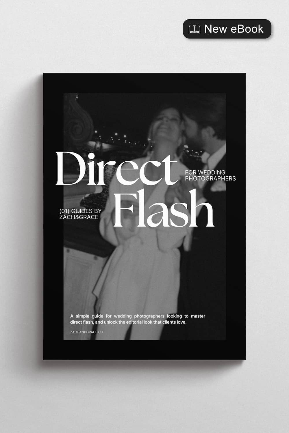 A black hardcover book titled 'Direct Flash' for wedding photographers, displayed against a light gray wall. The cover is black and white, featuring a black-and-white photograph of a couple.